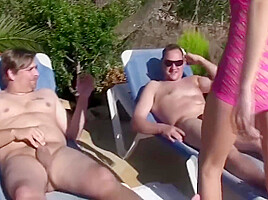Blonde Slut Is Pleasing Two Big Cocks Near The Pool