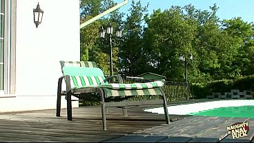 Blonde Polishes Herself By The Outdoor Pool